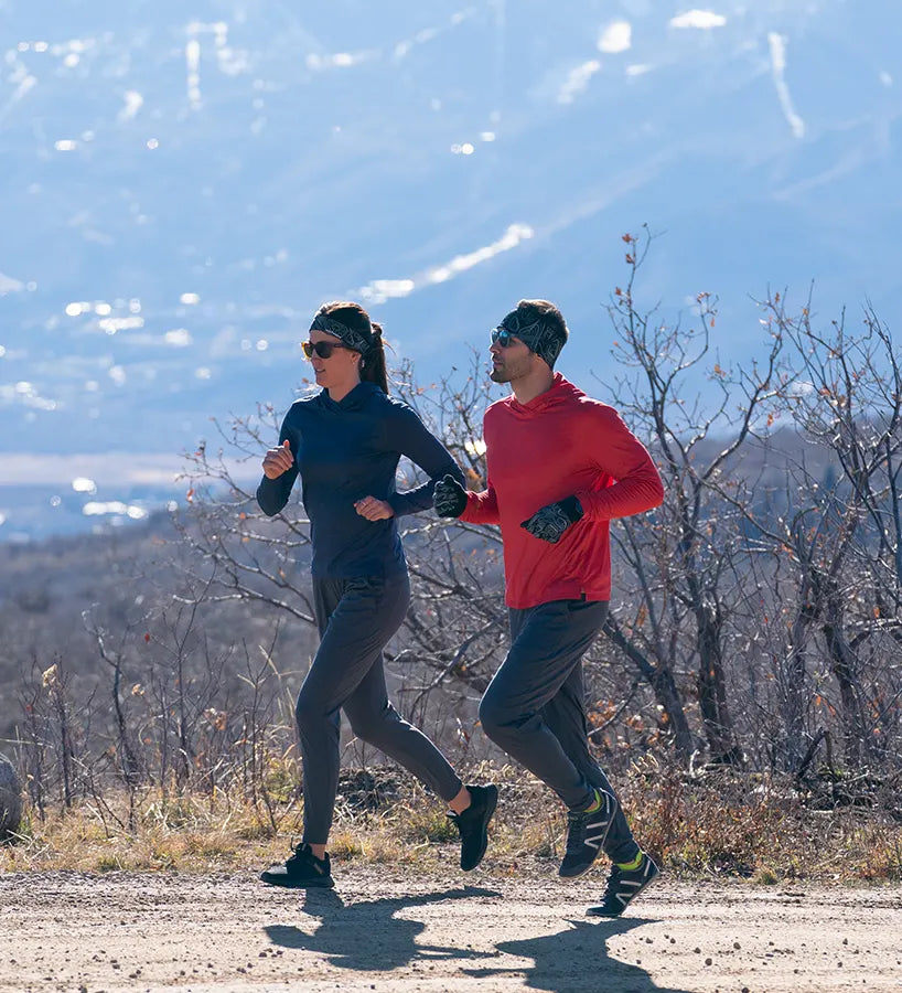 A pair of runners in cold weather gear.