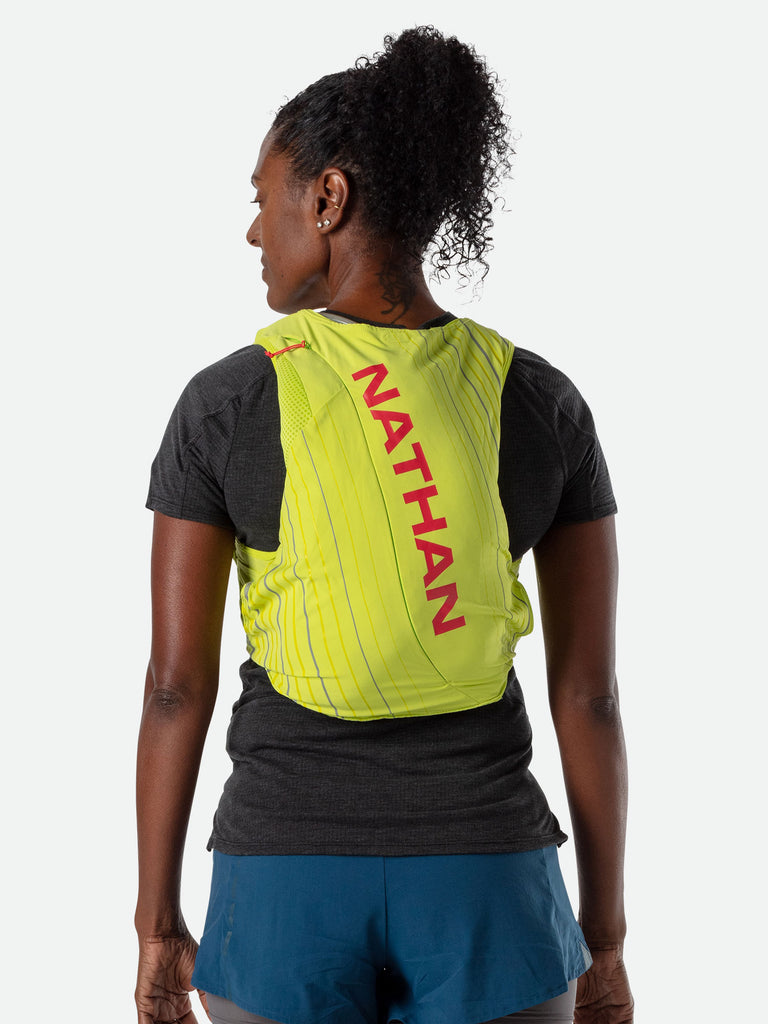 Nathan Pinnacle 12 Liter Women's Hydration Race Vest - Finish Lime/Hibiscus Red - Female Runner Back View