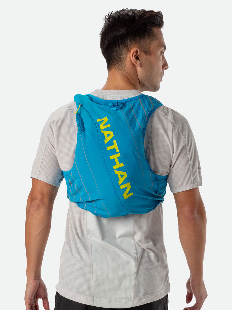 Nathan Pinnacle 12 Liter Unisex Hydration Race Vest - Blue Me Away/Finish Lime Green - Male Runner Back View