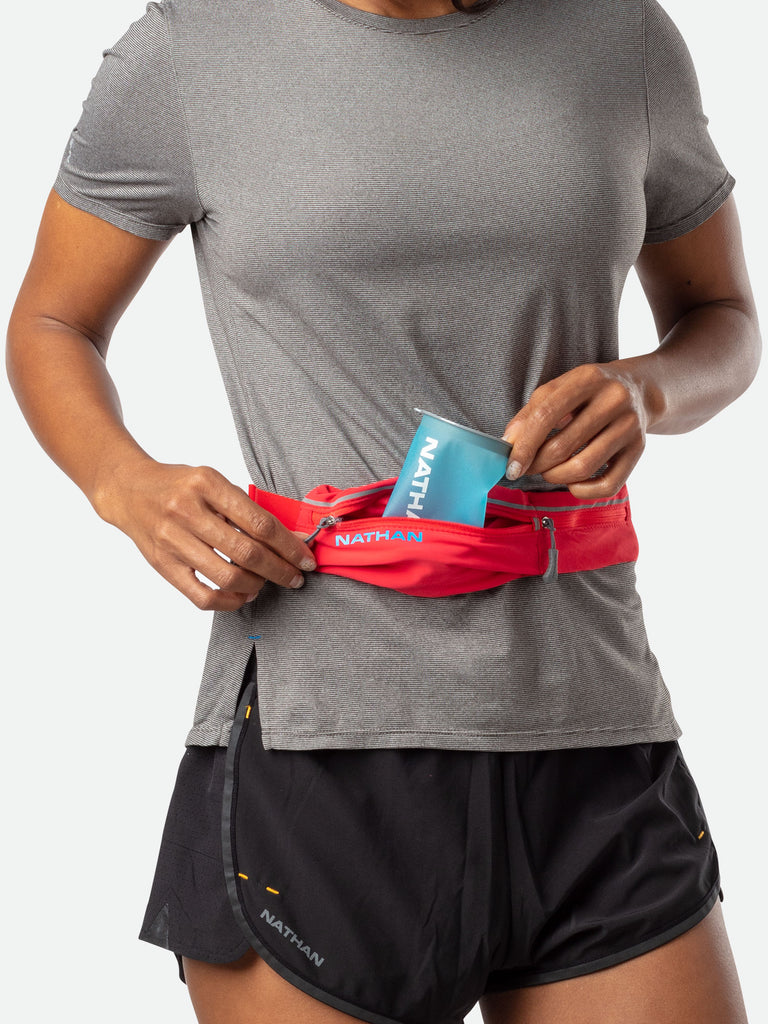 Nathan Reusable/Sustainable Blue Race Day Cup 2-Pack - Runner Pulling Reusable Cup Out of Waist Belt