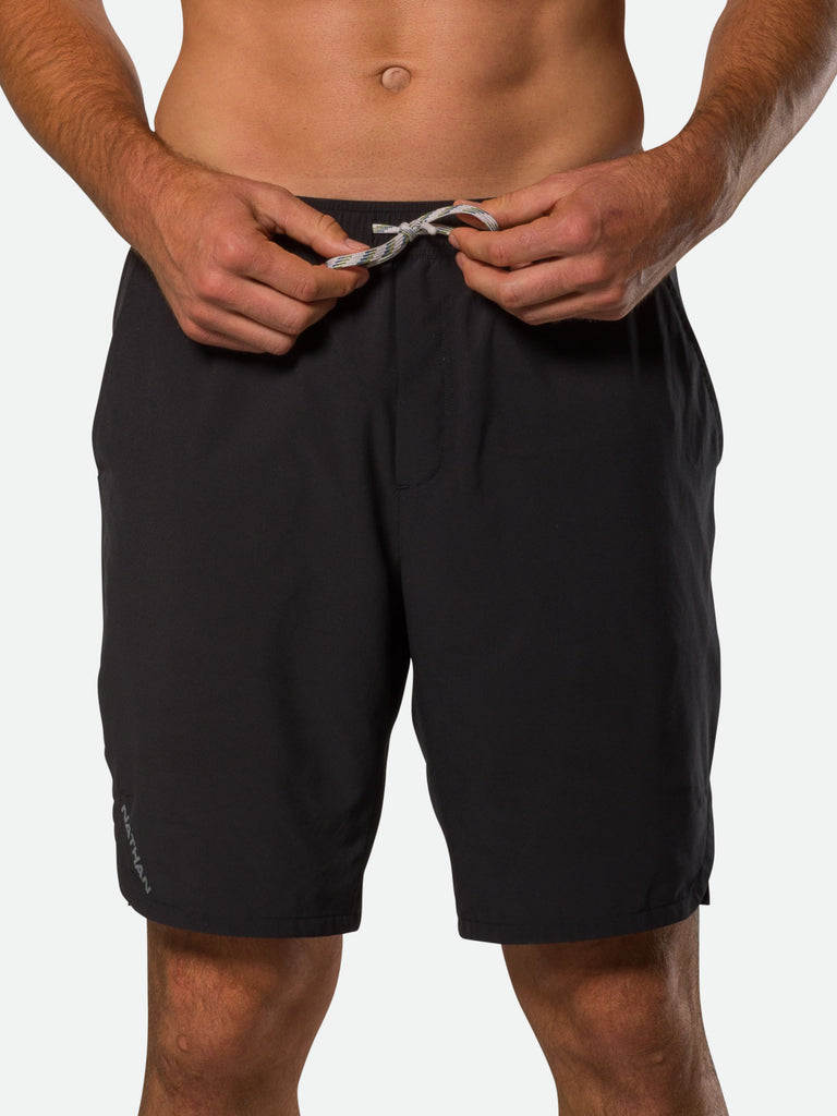Nathan Men's Essential Unlined 9” Inch Shorts – Black – On Model – Tightening Drawstring For Better Fit