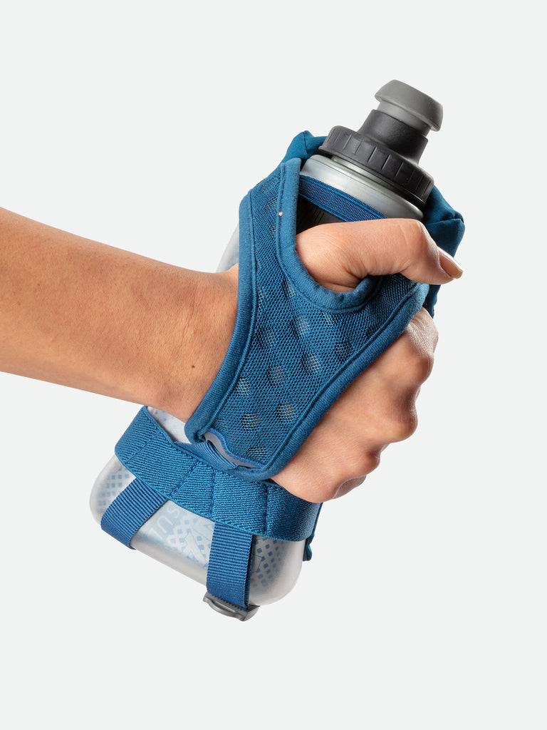 Nathan QuickSqueeze 12oz Insulated Hydration Handheld - Marine Blue/Mint - Runner Gripping Handheld Through Strap