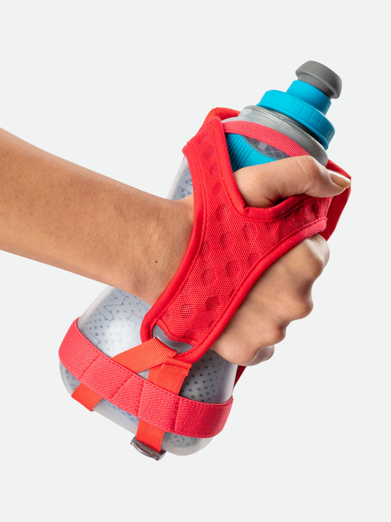 Nathan QuickSqueeze 18oz Insulated Hydration Handheld - Hibiscus Red/Blue Me Away - Runner Gripping Handheld Through Strap