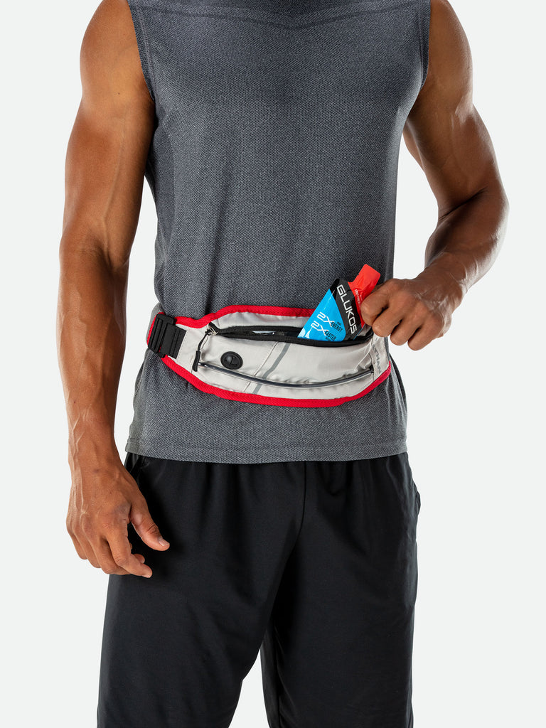 Nathan K9 Series Runner's Waistpack with Leash - Model pulling Glukos Energy Gel out of Waistpack