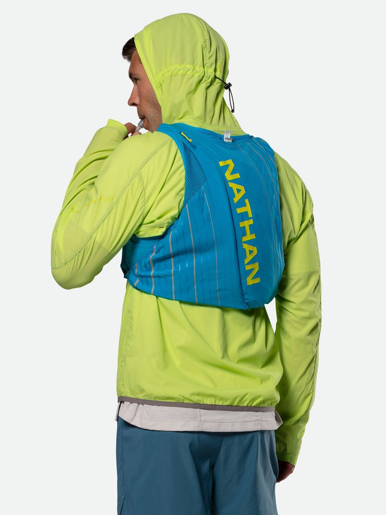 Nathan Men's Stealth Jacket – Acid Lime Green -  On Model – Wearing Hydration Pack with Jacket